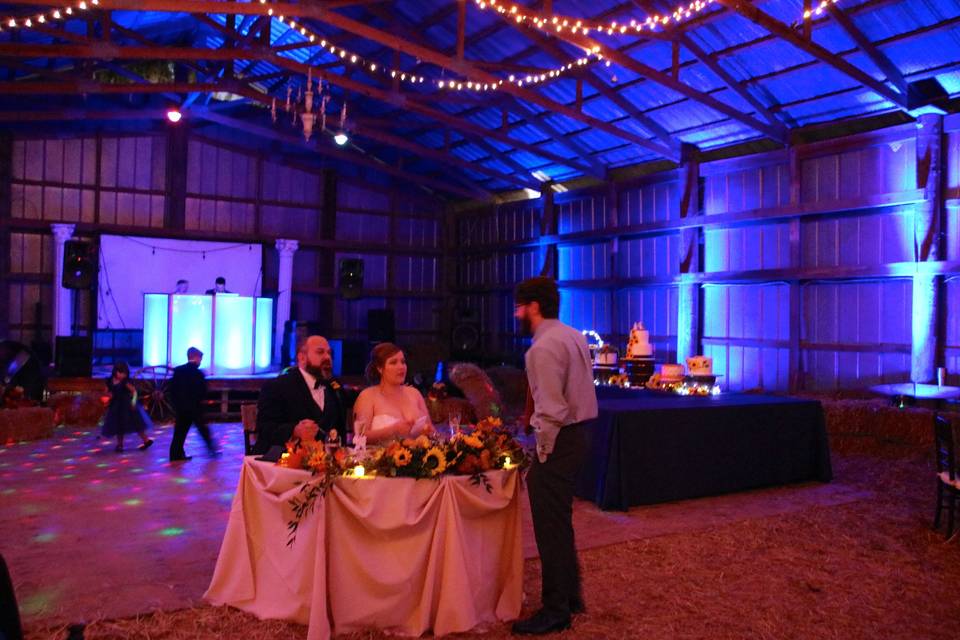 Fairy lights and uplighting in the barn
