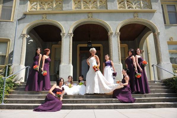 Bride, bridesmaids, and flower girls by the steps