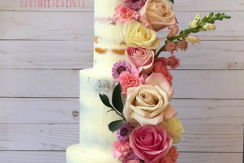 Naked wedding cake with flowers