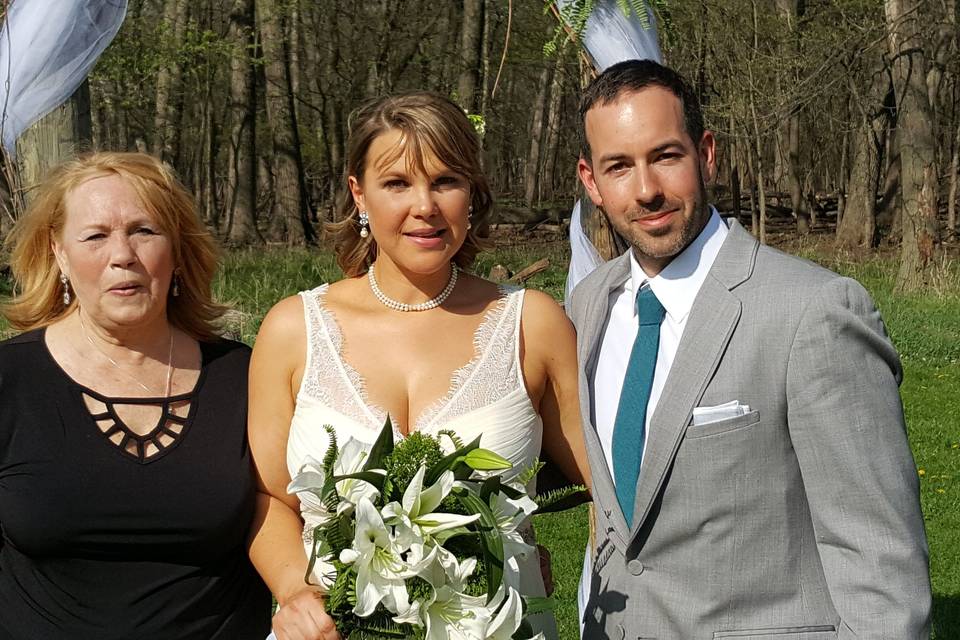 Newlyweds and officiant