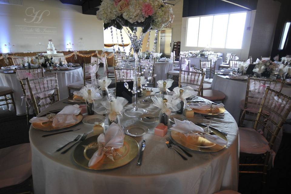 Sample table setting with backdrop of hall
