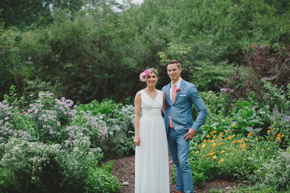 Couple's portrait in front of the herb garden