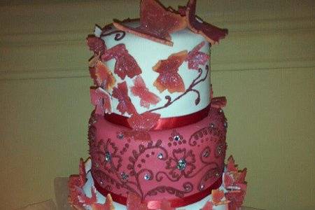 This Butterflies Cake was made to match a beautiful red gown that the bride was wearing.