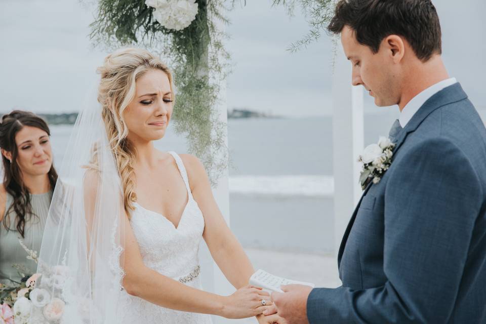 A bride and groom marry on Pine Point Beach