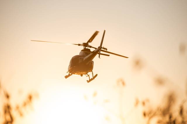Helicopter sunset takeoff
