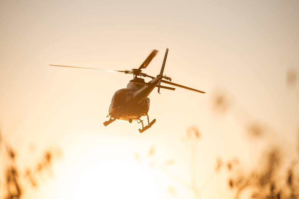 Helicopter sunset takeoff