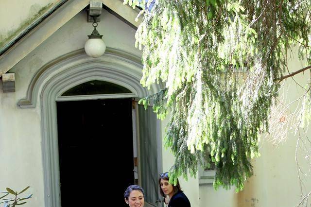 Debra of Weddings By Debra Thompson, LLC coordinating the bridesmaids out of the Laundry Building at Lyndhurst