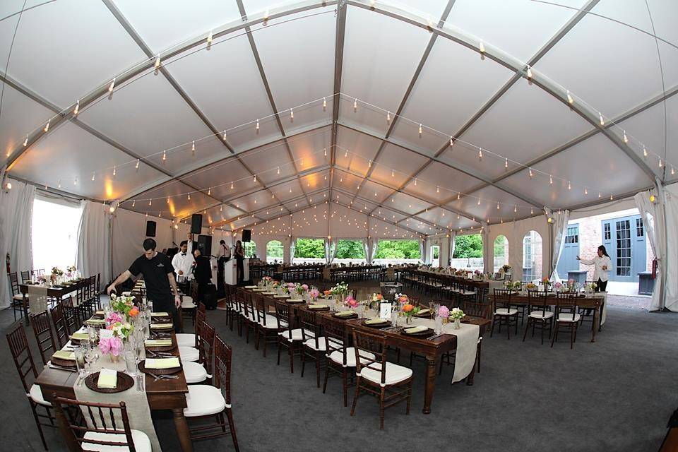 The gorgeous setup inside the tent provided by: Tent, lighting, tables and chairs: http://www.partylinerentals.com/ Floral: Willo Unlimited, Inc. Dinnerware, chargers and runners : https://www.partyrentalltd.com/