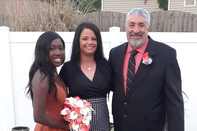 Bride and groom with their officiant