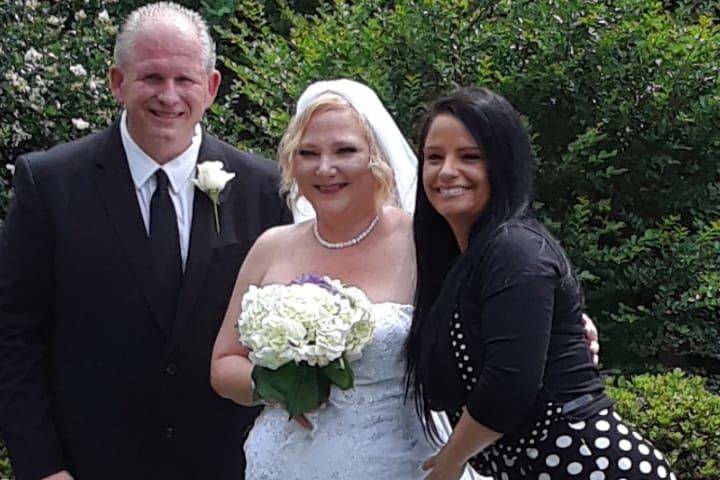 Newlyweds and the officiant