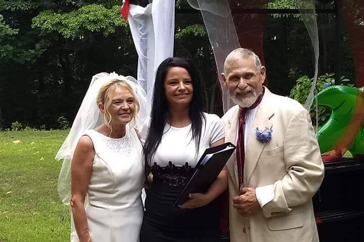 Officiant and the newlywed couple