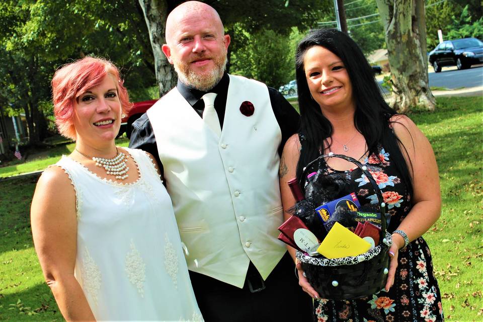 Officiant, groom, and bride