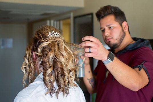 Jose styling the bride's hair