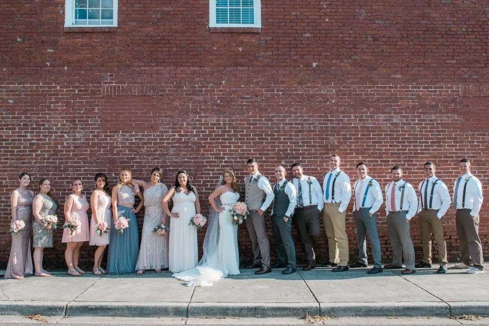 The couple with the bridesmaids and groomsmen