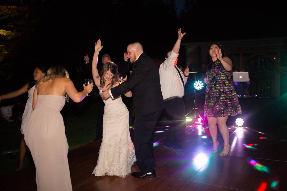 The couple and guests dancing