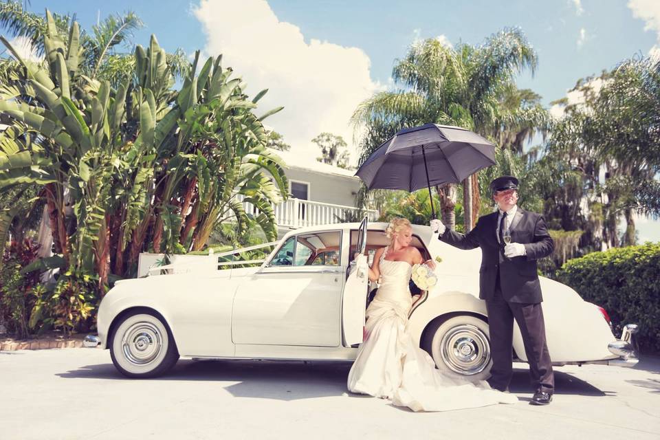 Escorting the bride out of the wedding car