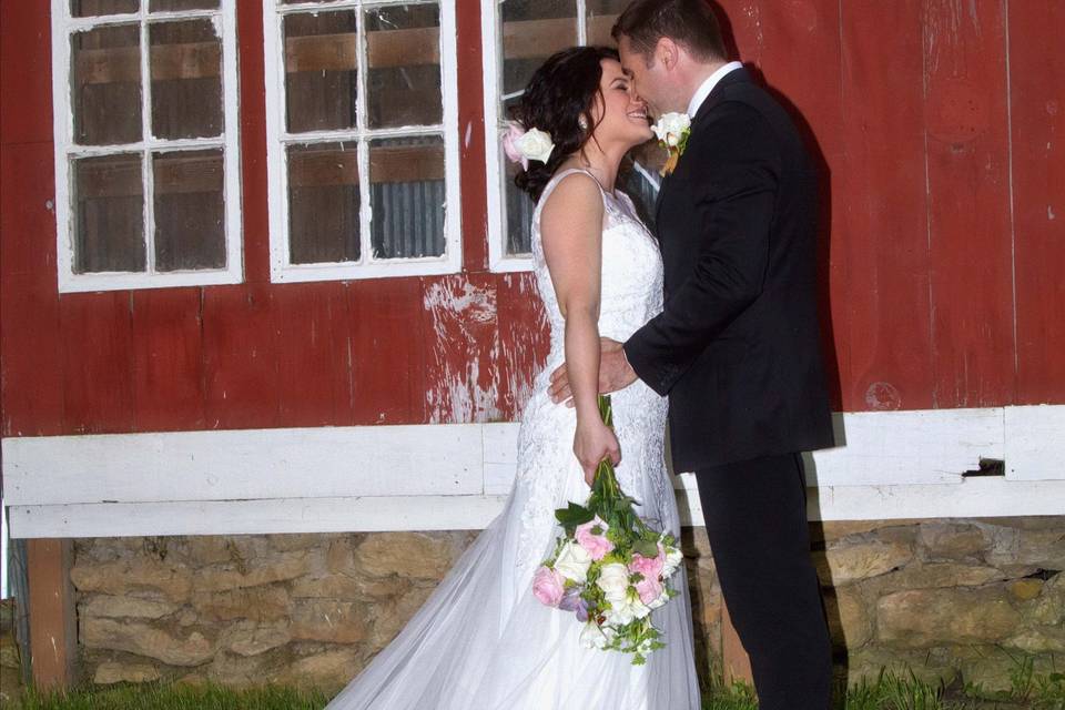 Couple kissingPhoto by Crooked River Farm Photography LLC