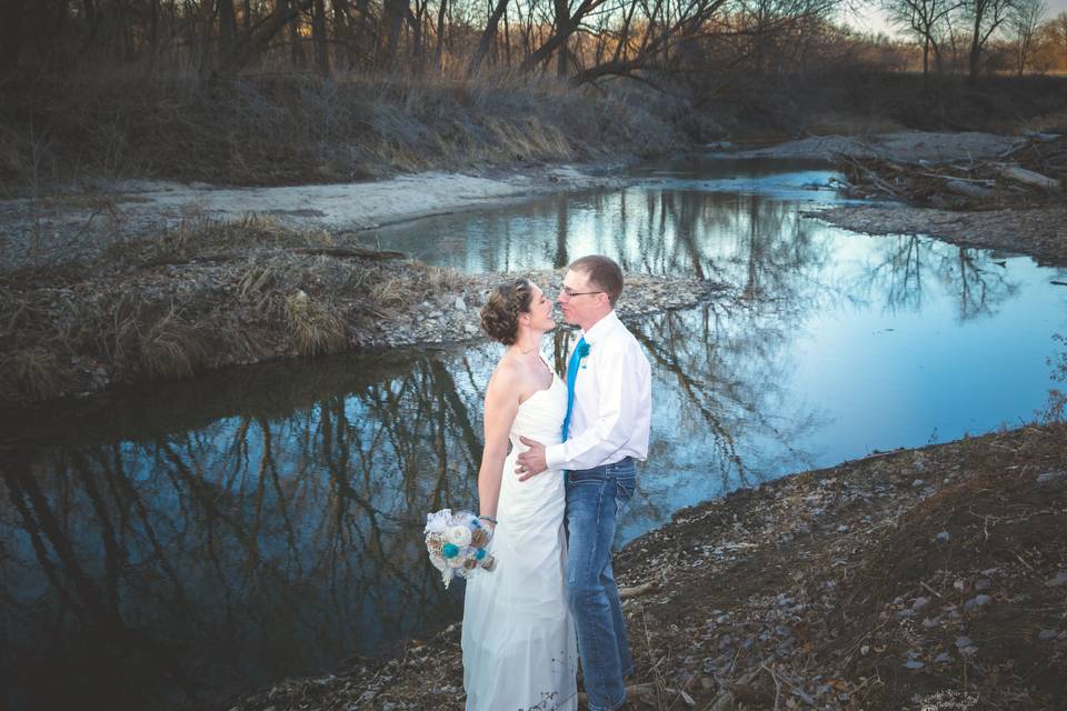 Couple portrait by the Crooked River.Photo by Crooked River Farm Photography LLC