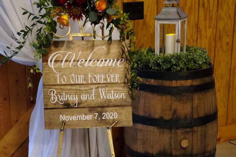 Custom Signs & floral swags