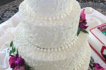 Three tier cake with flowers on top