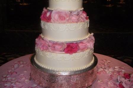 Three tier cake with black ribbon