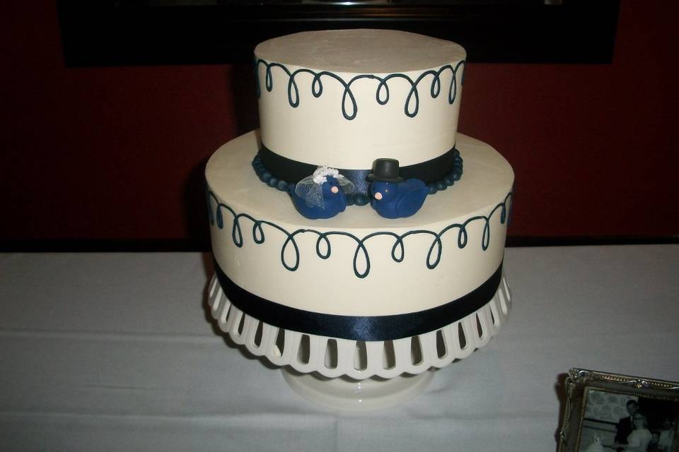 Two tier cake with blue bow