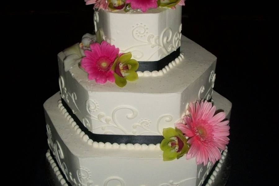 Three tier cake with pink flowers