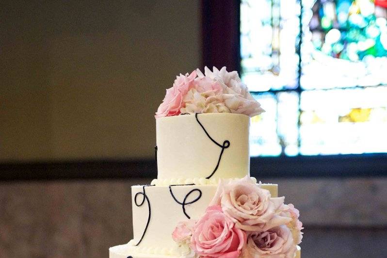 Four tier square cake with embellishments