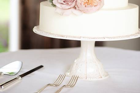 Three tier wedding cake with flowers