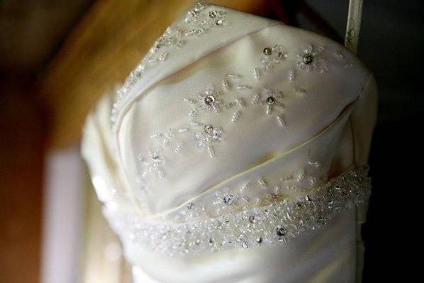 A close up detailing the wedding dress