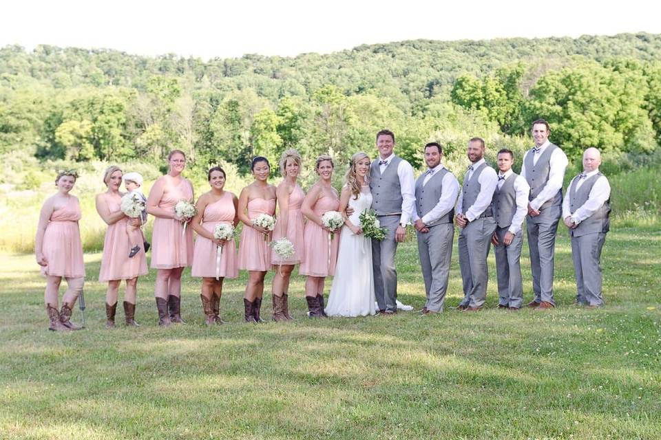 The couple with the bridesmaids and groomsmen