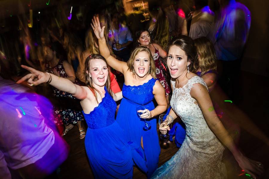 Bride and bridesmaids dancing