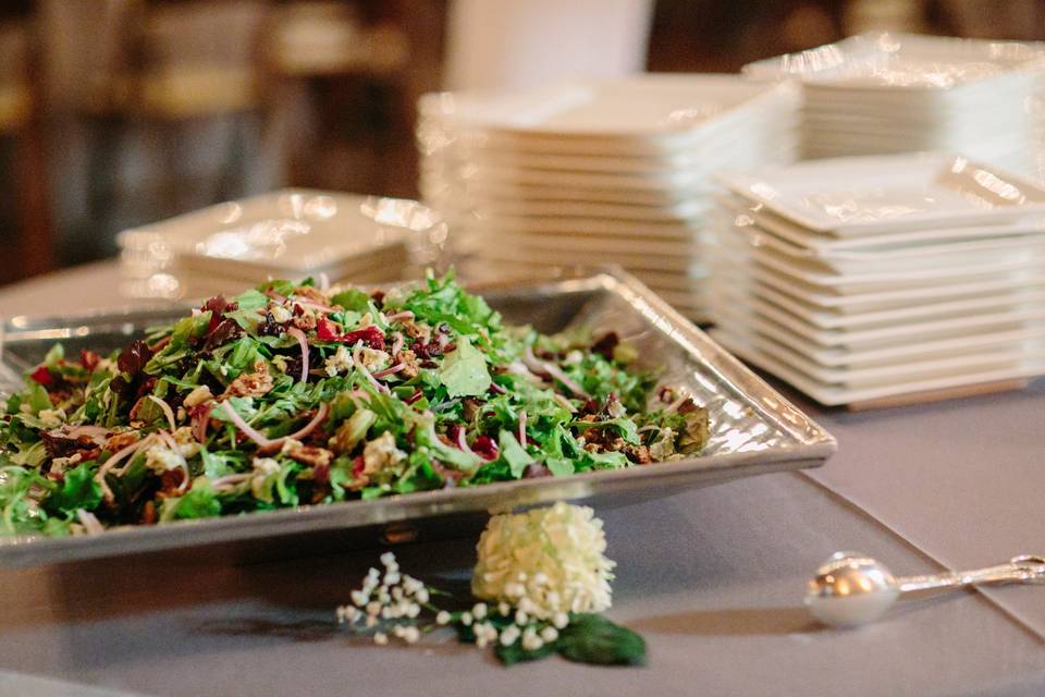 Fresh berries, crumbled blue cheese, sugar and spice pecans and a homemade poppy seed dressing atop arugula and other salad greens