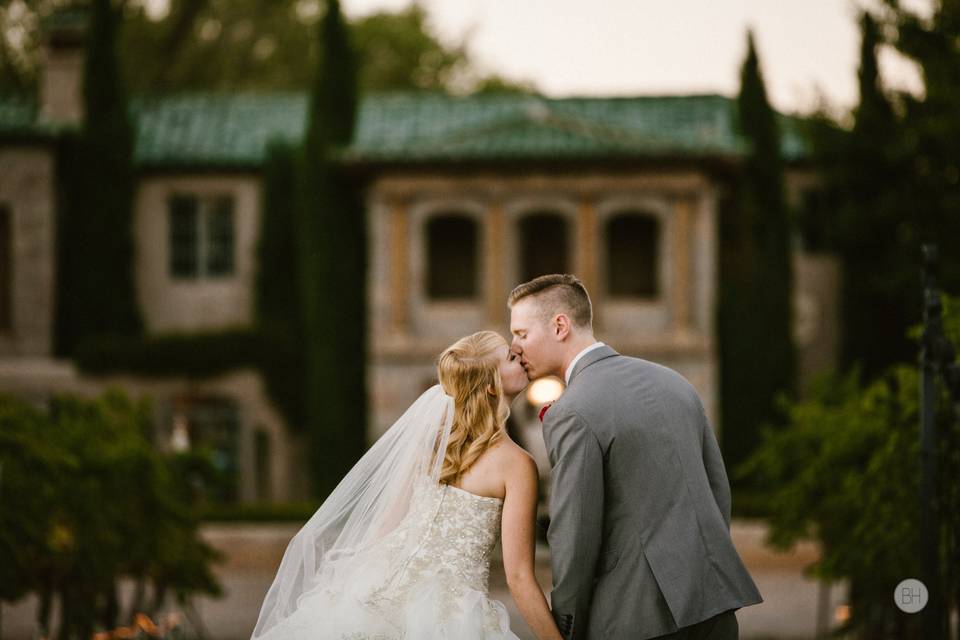 Couple embracing in an orchard