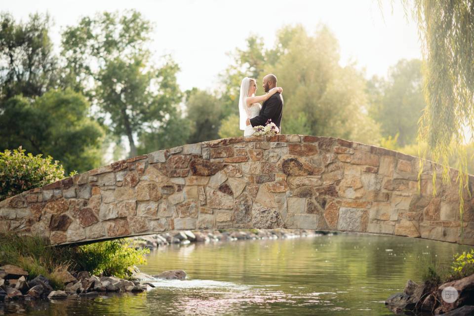 Newlyweds on a bridge