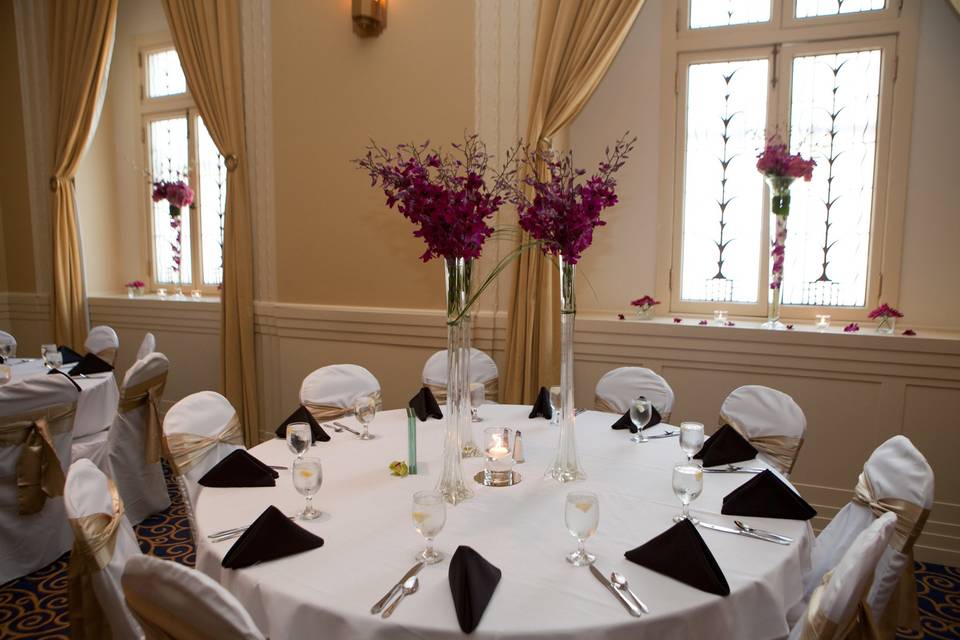 Table setup with candle and floral centerpiece