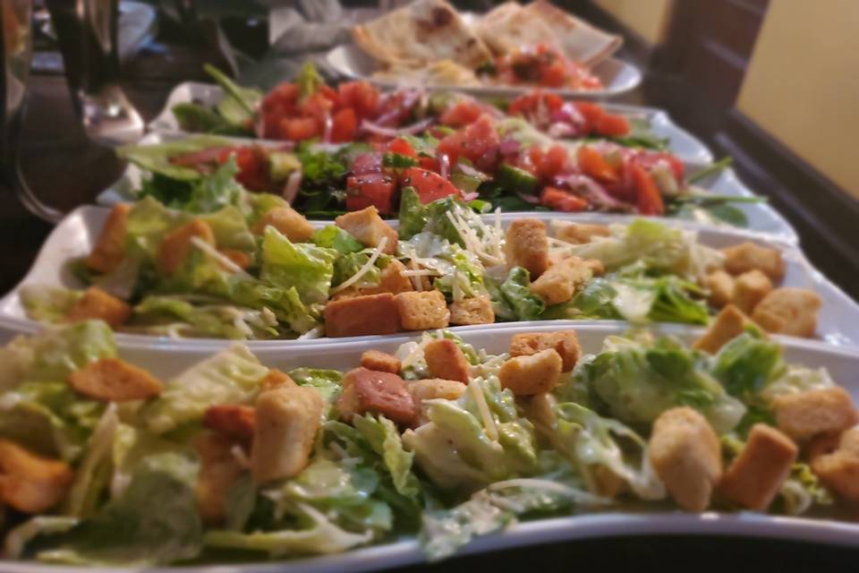Plated salads for bride and groom
