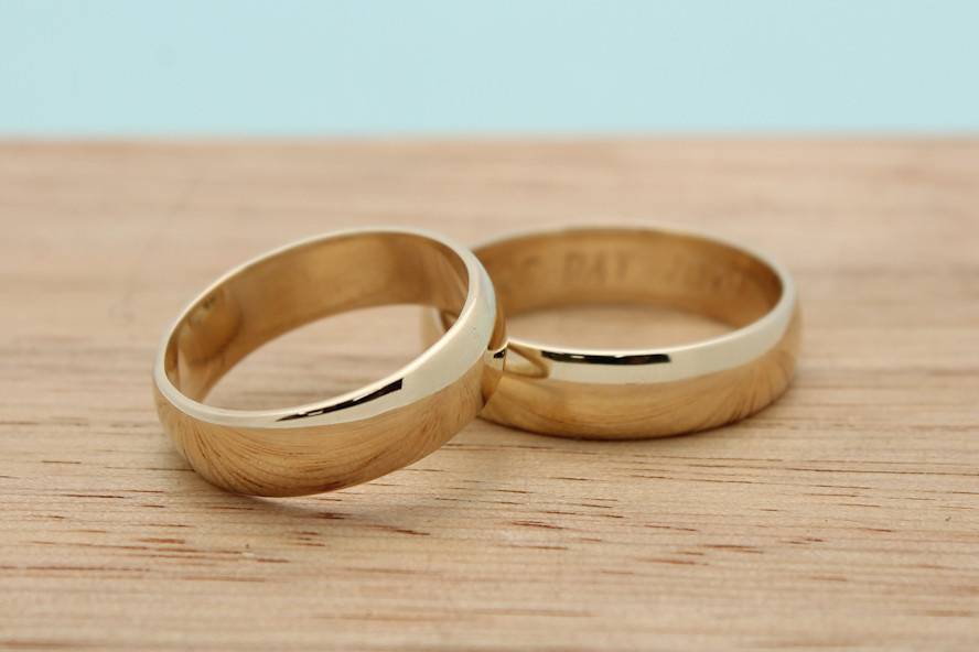 Classic wide bands in recycled 14k yellow gold.