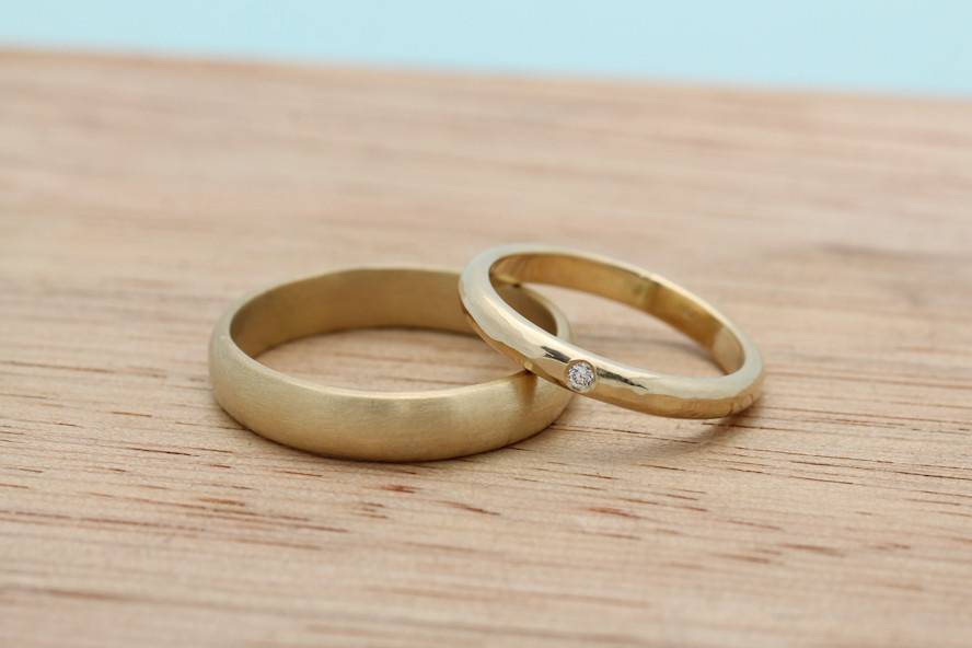 Recycled gold bands with flush set diamond