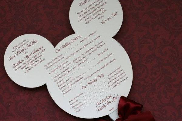 Perfect for destination wedding, or if doing a disney themeMickey Mouse head diecut wedding program, double sided, with white plastic handle and ribbon trim.So much fun, a big hit with all