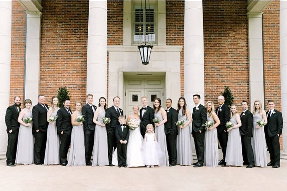 Newlyweds with the wedding attendants