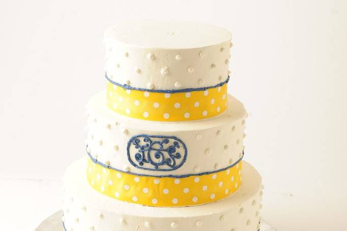 Yellow And Blue Polka Dots On White Cake