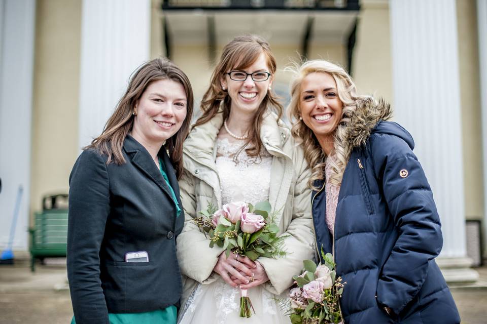 Posing with the bride and her sister