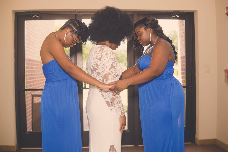 Praying bridesmaids