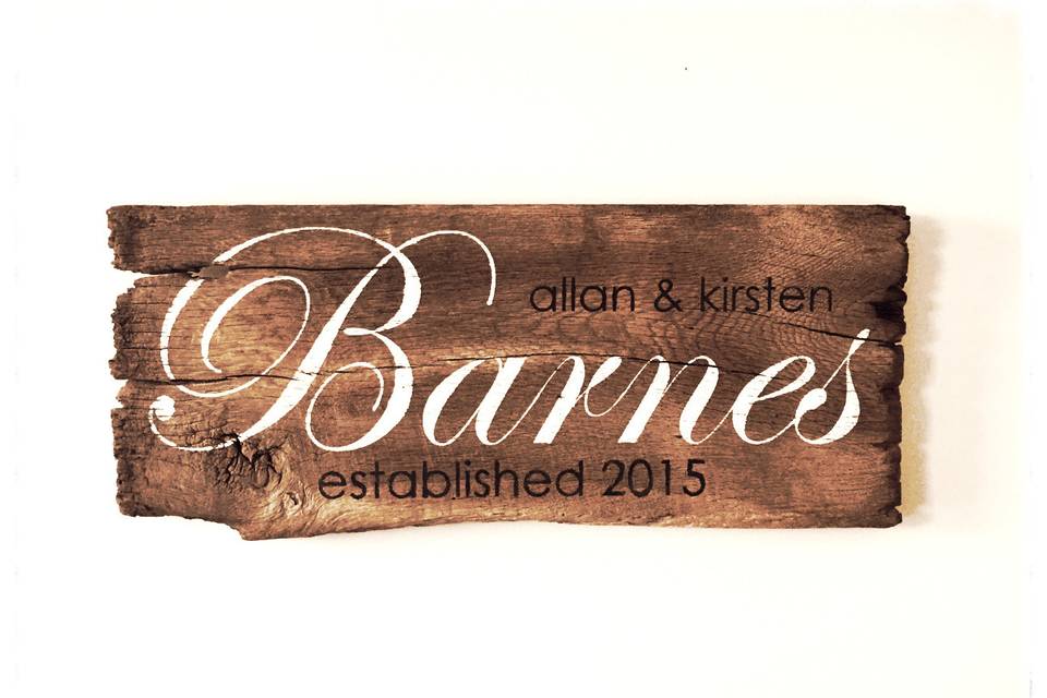 One of our favorites!  Hand painted barn wood sign with the couple's new last name, first names and year.  The year can also be replaced with the wedding date!