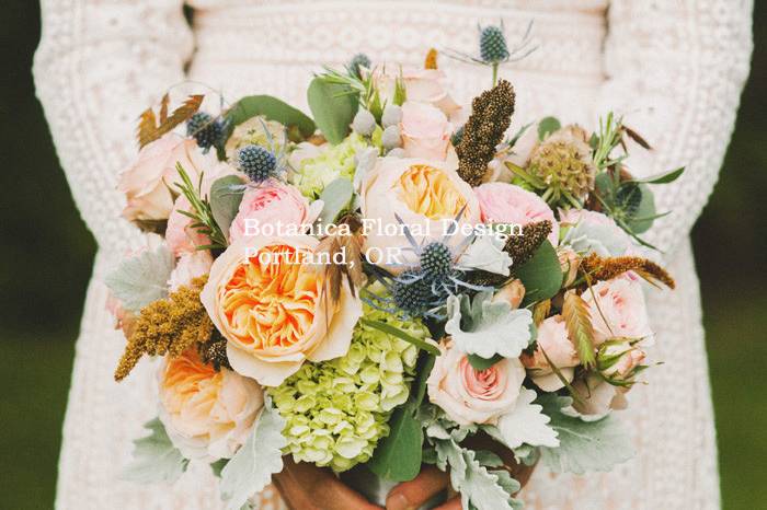 Sleeved wedding gown and bouquet