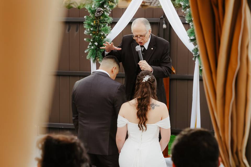 Image 1 (Officiant & Couple):