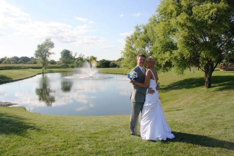 Newlyweds by the pond