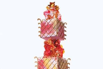 Two-tiered cake decorated with translucent pink sugar glass 