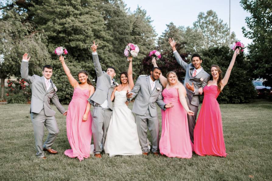 The couple with the bridesmaids and groomsmen